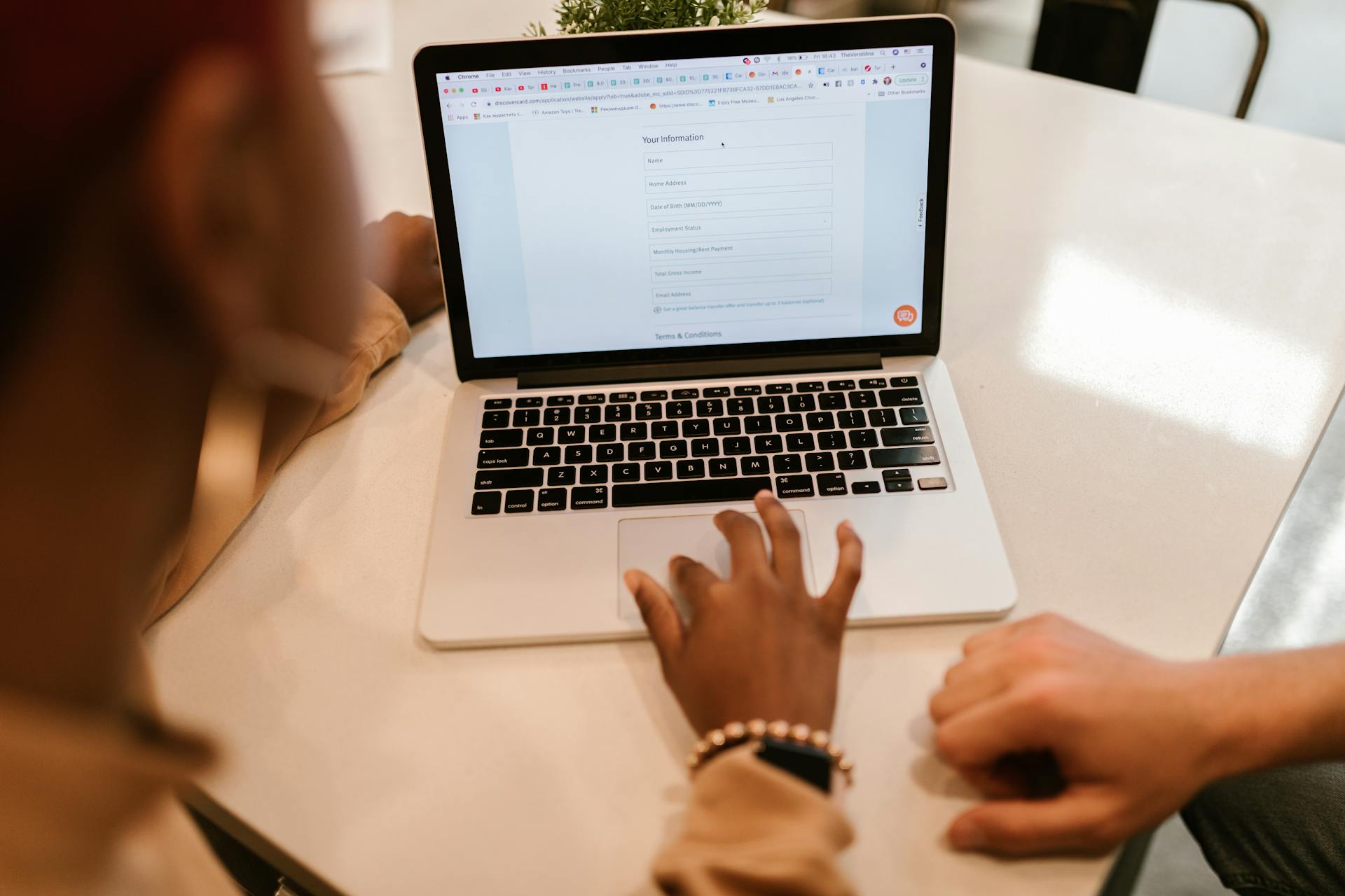 Person filling out a legal form on laptop